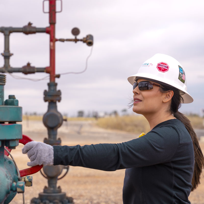 Maverick employee performing safety inspections and checks at field operations site