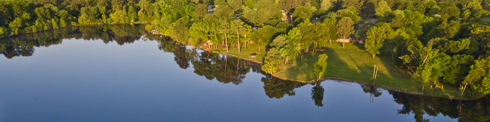 Panoramic view of a residential area with a lake